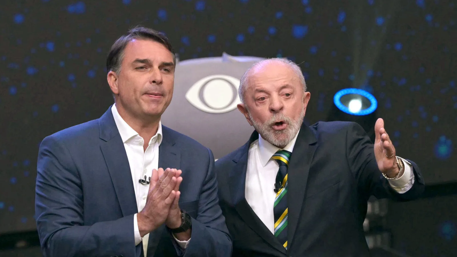 Lula e Flávio Bolsonaro durante o debate presidencial da Band.